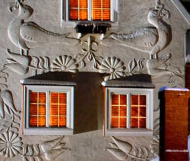 Doves on building at night