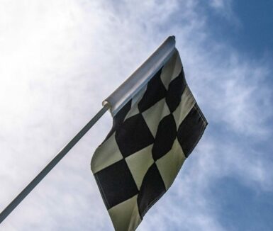 Racing flag up in the sky | Maple Grove raceway