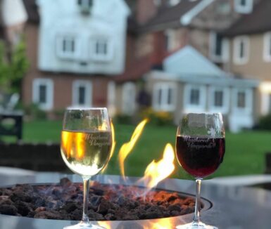 Wine and Fire Pit with historic bed and breakfast in background